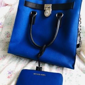 Michael Kors with matching wallet.